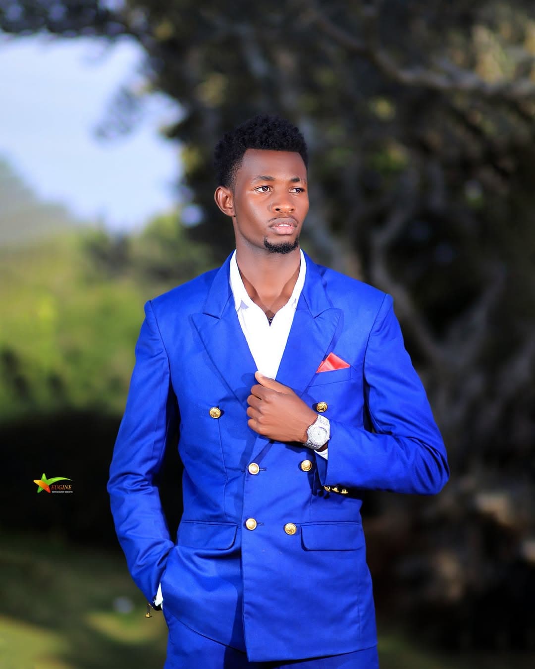 Outdoor portrait of a man in a royal blue double-breasted suit