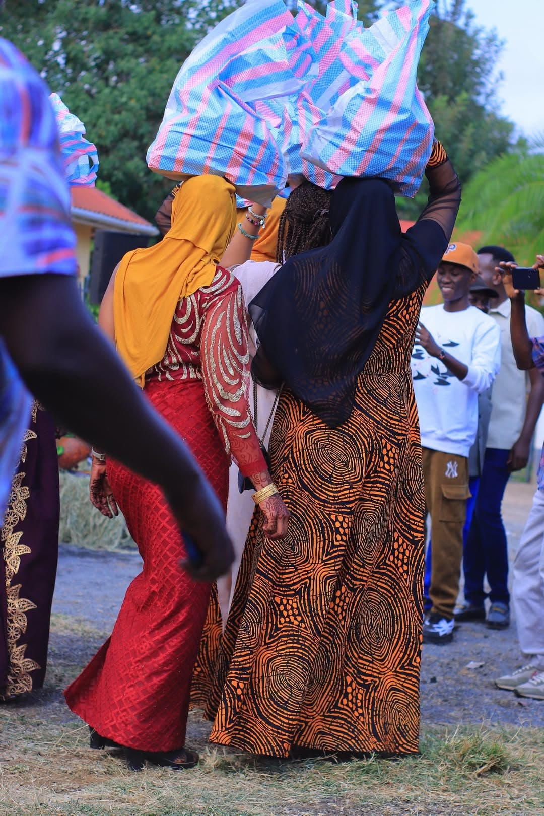 Women carrying gifts on their heads in a ruracio procession